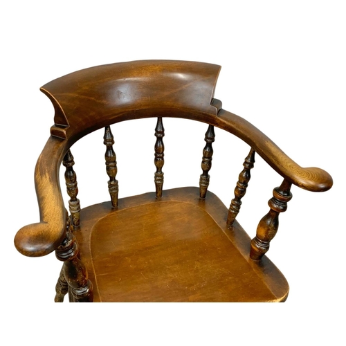 837 - A Victorian elm armchair.