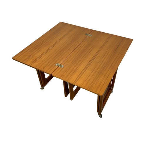 843 - A McIntosh teak “Triform” fold over coffee nest of tables. Mid Century. 74 x 40.5 x 60.5cm