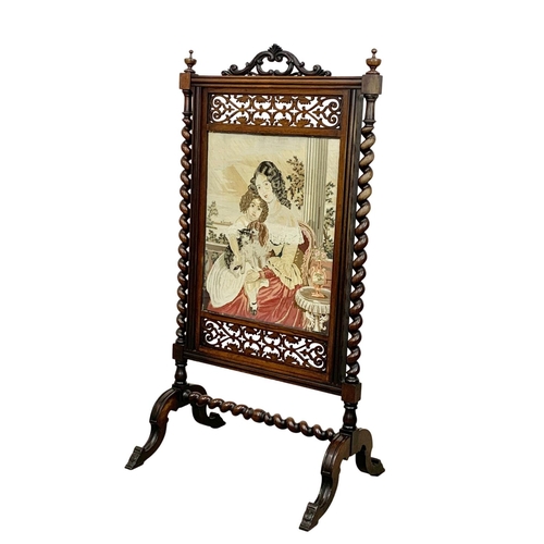 858 - A large Victorian carved rosewood fire screen. 57 x 109.5cm