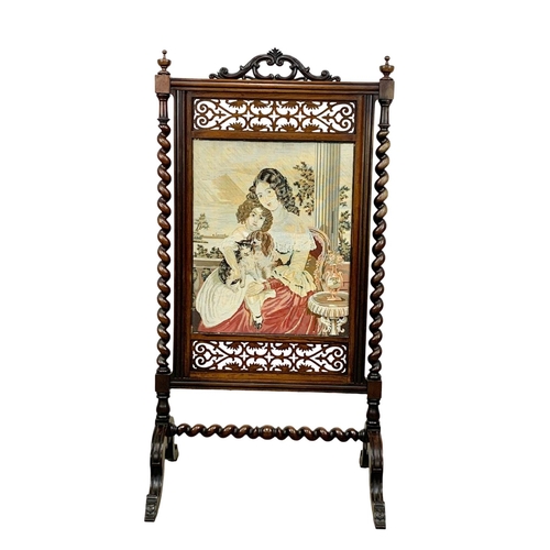 858 - A large Victorian carved rosewood fire screen. 57 x 109.5cm