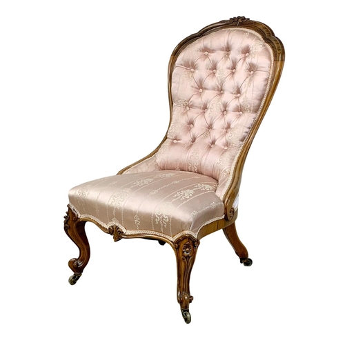 859 - A Victorian carved rosewood nursing chair on cabriole legs. Circa 1870. 52 x 74 x 98cm