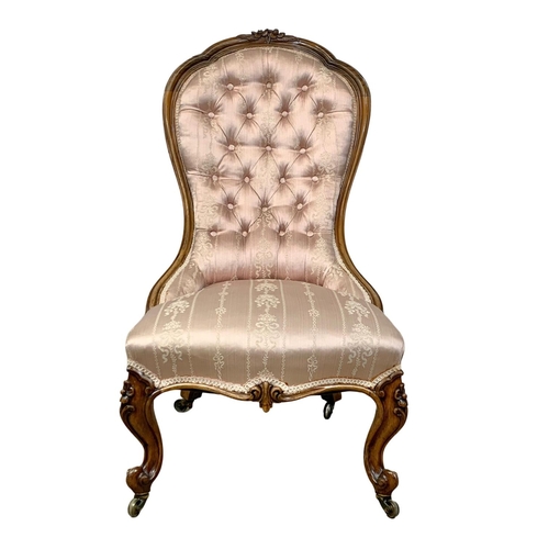 859 - A Victorian carved rosewood nursing chair on cabriole legs. Circa 1870. 52 x 74 x 98cm