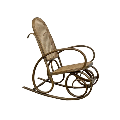 861 - A vintage Bentwood rocking chair with bergere back and seat 49.5 x 92 x 99cm.