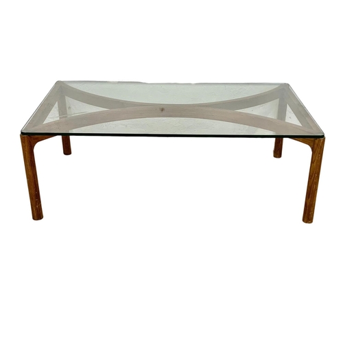 870 - A Danish teak framed glass top coffee table. Mid Century. 1960’s. 111 x 65 36.5cm