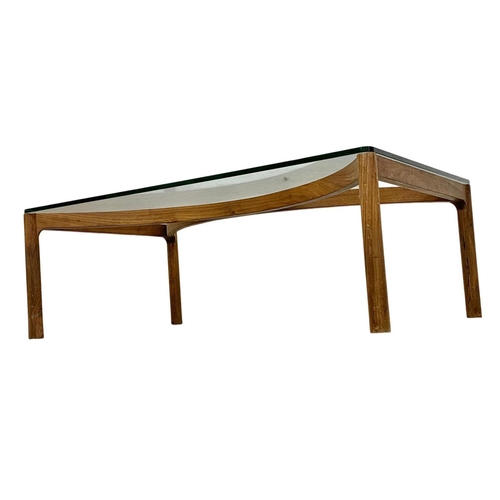 870 - A Danish teak framed glass top coffee table. Mid Century. 1960’s. 111 x 65 36.5cm