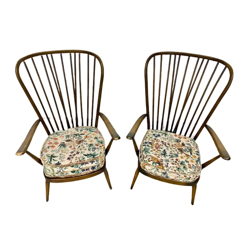 917 - A pair of Ercol model 478 high back armchairs. Mid Century.