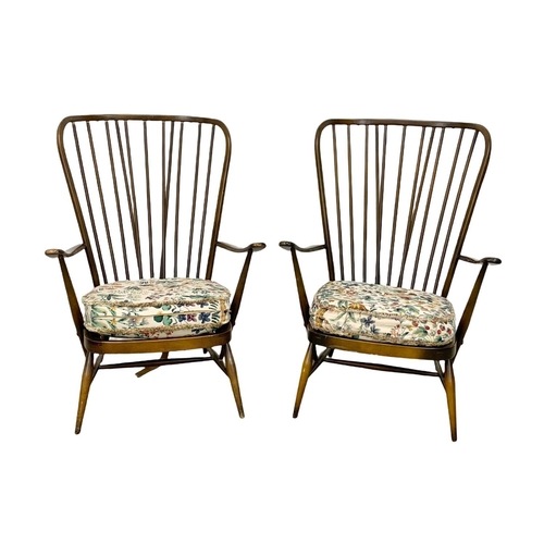 917 - A pair of Ercol model 478 high back armchairs. Mid Century.