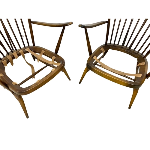 917 - A pair of Ercol model 478 high back armchairs. Mid Century.