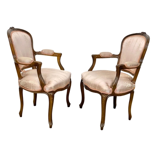 923 - A pair of 18th century style French armchairs.