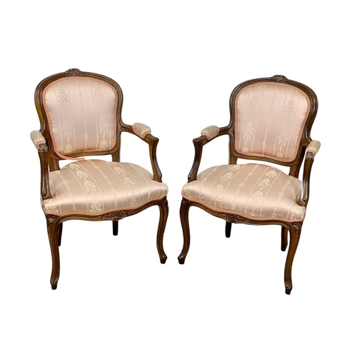 923 - A pair of 18th century style French armchairs.