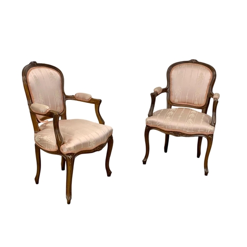 923 - A pair of 18th century style French armchairs.