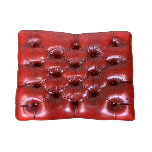 935 - A deep button ox-blood leather footstool. 66 x 50 x 30cm