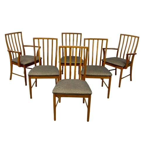 940 - A McIntosh teak extending dining table and 6 chairs. Mid Century. 1970. Extended 203 x 98 x 77cm. Cl... 