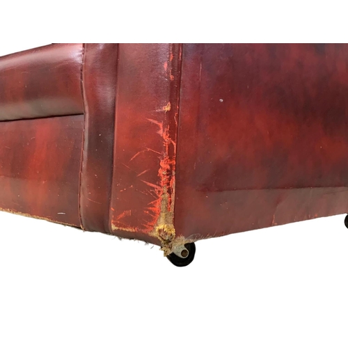 946 - An ox-blood leather button back 3 seater sofa. 191cm.