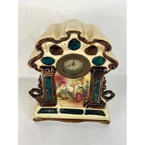 95 - A late Victorian pottery mantle clock. 23 x 30cm.