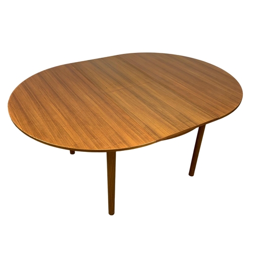 966 - A McIntosh teak Mid Century extending dining table. Extended 167.5 x 122 x 74cm. Closed 122cm