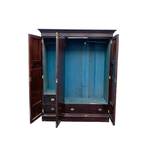 971 - An Edwardian 3 door wardrobe. 167 x 60 x 206.5cm