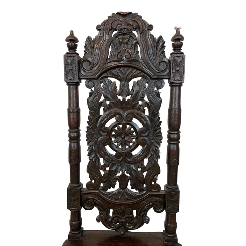 981 - A Victorian carved oak high back hall chair. Circa 1880. 130cm.