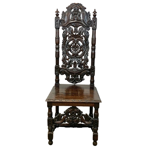 981 - A Victorian carved oak high back hall chair. Circa 1880. 130cm.