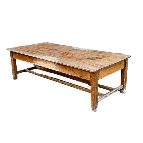 986 - A very large late 19th century pitch pine table. Possibly from old warehouse or mill.  Circa 1890. 2... 