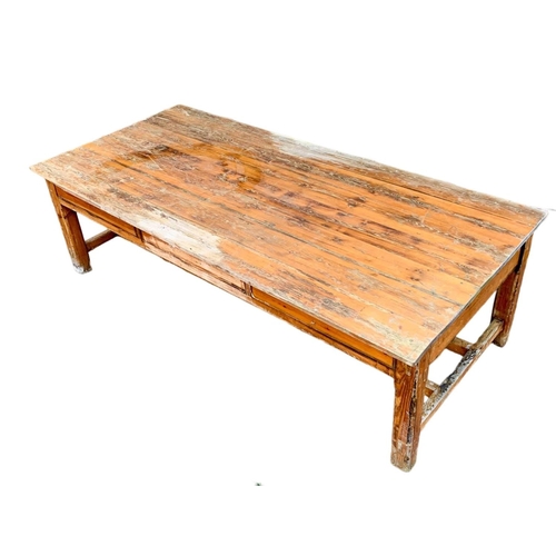 986 - A very large late 19th century pitch pine table. Possibly from old warehouse or mill.  Circa 1890. 2... 