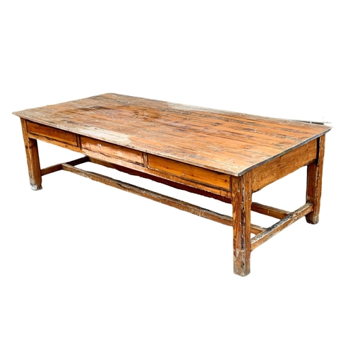 986 - A very large late 19th century pitch pine table. Possibly from old warehouse or mill.  Circa 1890. 2... 