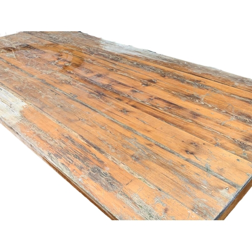 986 - A very large late 19th century pitch pine table. Possibly from old warehouse or mill.  Circa 1890. 2... 