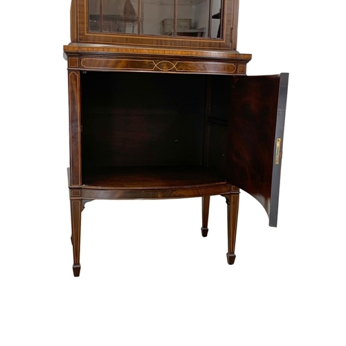 993 - A vintage inlaid mahogany display cabinet in the Sheraton and Federal style. 66 x 40 x 199cm.