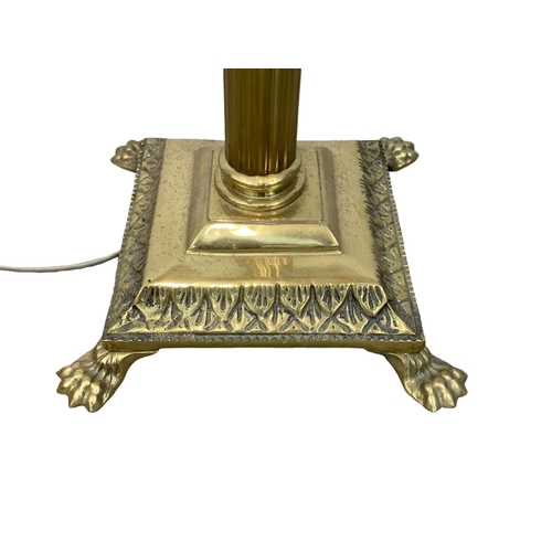 994 - A vintage brass standard lamp with Corinthian pillars. 168cm