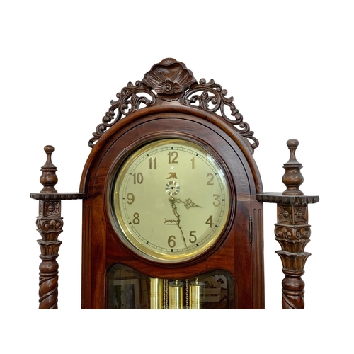 995 - A large ornate carved mahogany German long case clock by Junghans. With weights and pendulum. 85 x 4... 