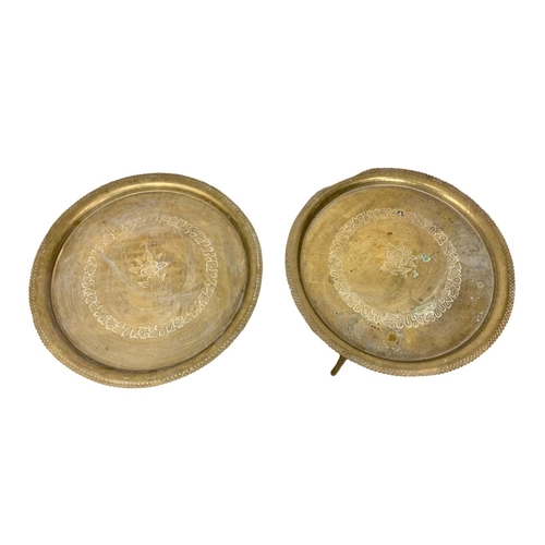 996 - A pair of early 20th century folding Middle Eastern brass tables. 59.5 x 44cm.