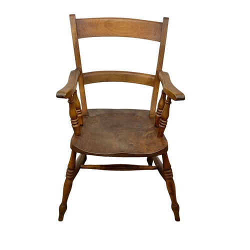 999 - A Victorian elm kitchen armchair.