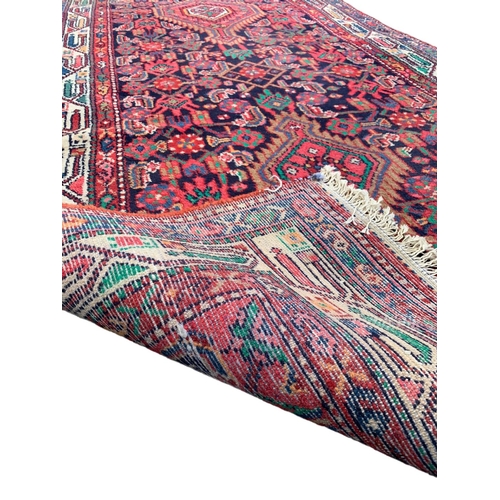 1065 - A vintage Hamadan North West Iran hand knotted runner rug. 114 x 342cm.