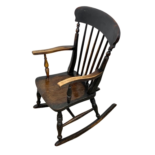 1080 - A Victorian elm and beech rocking chair. Circa 1860-1870.