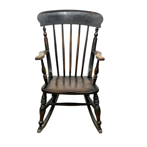 1080 - A Victorian elm and beech rocking chair. Circa 1860-1870.