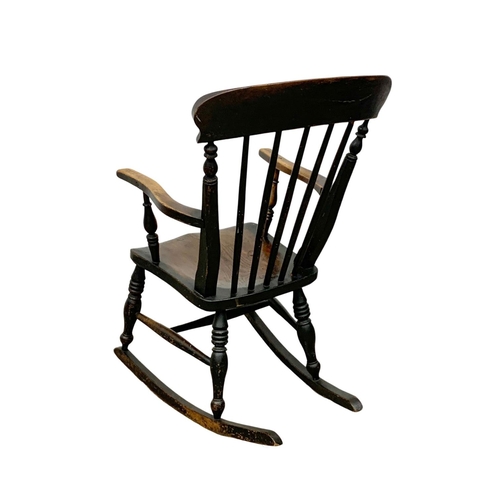 1080 - A Victorian elm and beech rocking chair. Circa 1860-1870.