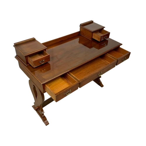 1082 - A late Victorian mahogany dressing table top with a later base. 122 x 54 x 96.5cm