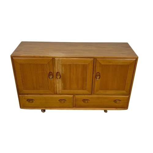 887 - An Ercol Blonde elm Mid Century sideboard. 130 x 44 x 76cm.