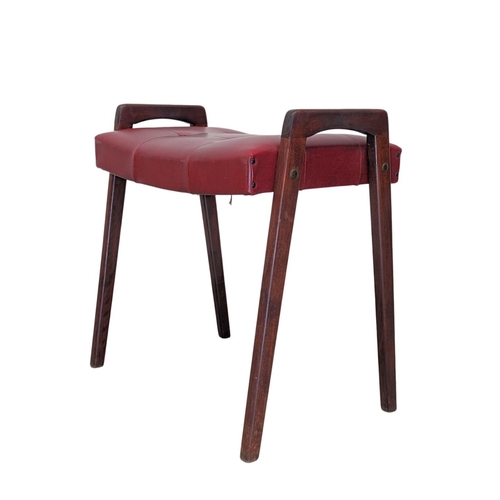 900 - A Danish Mid Century stool with buttoned red vinyl seat. 57.5 x 35 x 55cm