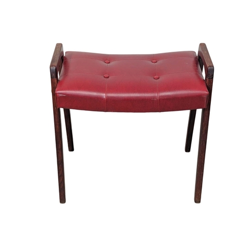 900 - A Danish Mid Century stool with buttoned red vinyl seat. 57.5 x 35 x 55cm