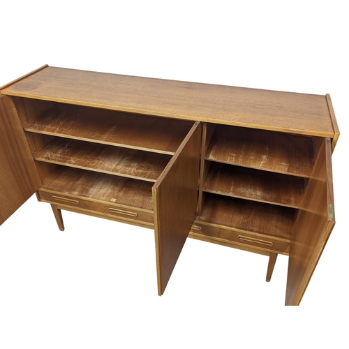 907 - A Danish teak Mid Century high sideboard with 4 drawers. Mid Century Denmark. 1960. 170 x 44 x 110cm... 