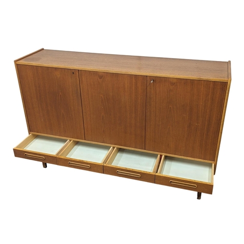 907 - A Danish teak Mid Century high sideboard with 4 drawers. Mid Century Denmark. 1960. 170 x 44 x 110cm... 