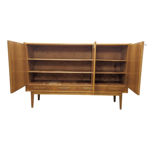 907 - A Danish teak Mid Century high sideboard with 4 drawers. Mid Century Denmark. 1960. 170 x 44 x 110cm... 