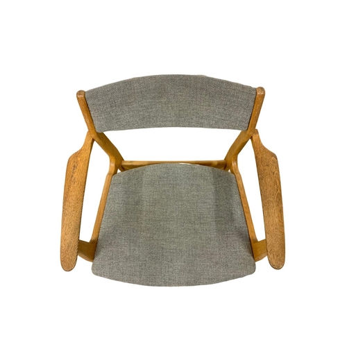 915d - A Danish desk chair designed by Erik Buch. Mid Century 1958. In oak and original grey upholstery.