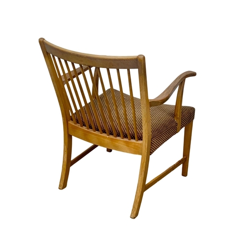 915e - A Danish oak Mid Century lounge armchair. 59 x 77 x 78.5cm.