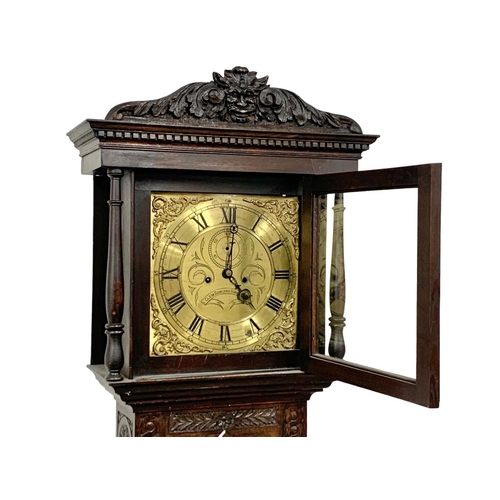 1083 - A Mid 19th century long case clock by Clem Gowland Sunderland in a carved oak case. Circa 1850-1860.... 