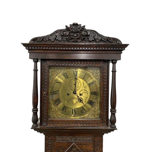 1083 - A Mid 19th century long case clock by Clem Gowland Sunderland in a carved oak case. Circa 1850-1860.... 