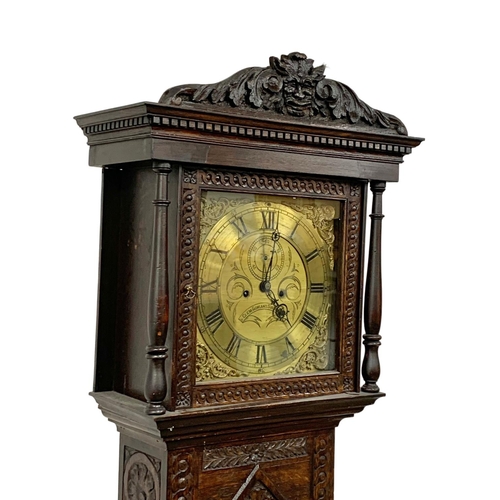 1083 - A Mid 19th century long case clock by Clem Gowland Sunderland in a carved oak case. Circa 1850-1860.... 