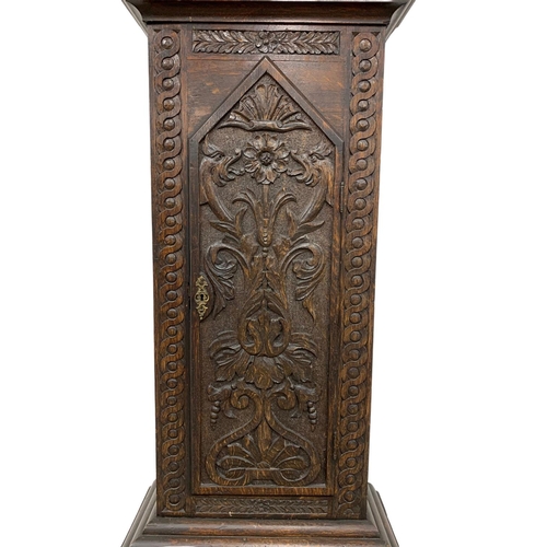 1083 - A Mid 19th century long case clock by Clem Gowland Sunderland in a carved oak case. Circa 1850-1860.... 