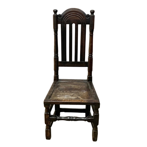 1084 - A 17th century oak hall chair. Made in the Carolean period. Circa 1660-1680.